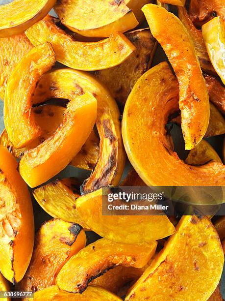 butternut squash, sliced and roasted - winter squash stock pictures, royalty-free photos & images