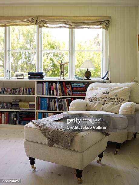 traditional living room with armchair and footstool - dänemark gemütlich stock-fotos und bilder