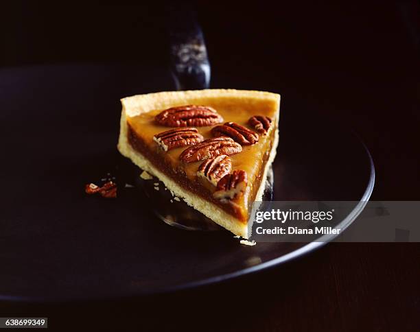 slice of pecan pie on plate - pecan pie stock pictures, royalty-free photos & images