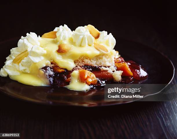 fruit trifle with custard and cream on plate - trifle stock pictures, royalty-free photos & images