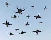 Swarm of drones flying in the sky