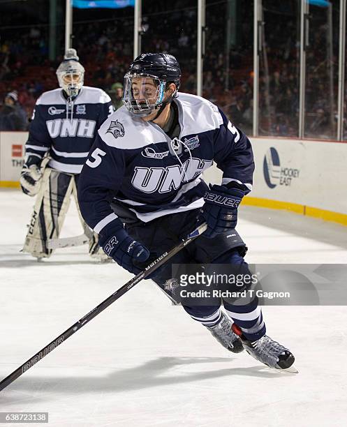 Dylan Chanter of the New Hampshire Wildcats skates against the Northeastern Huskies during NCAA hockey at Fenway Park during "Frozen Fenway" on...