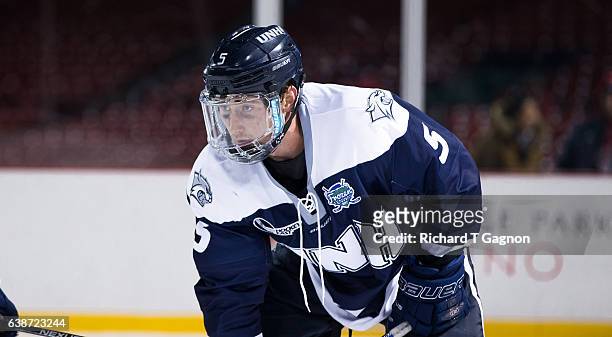 Dylan Chanter of the New Hampshire Wildcats skates against the Northeastern Huskies during NCAA hockey at Fenway Park during "Frozen Fenway" on...