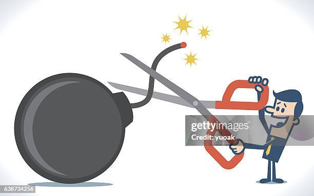 man's hand holding scissors to cut bomb - holding scissors stock illustrations