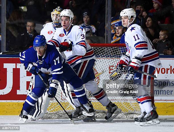 Rich Clune of the Toronto Marlies fights for crease space with Casey Nelson, Tim Kennedy and Linus Ullmark of the Rochester Americans during AHL Game...