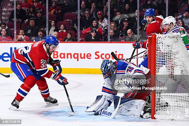 Brian Flynn of the Montreal Canadiens skates towards goaltender Henrik Lundqvist of the New York Rangers during the NHL game at the Bell Centre on...