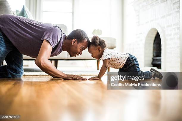 father and daughter playing on the floor - one year old stock pictures, royalty-free photos & images