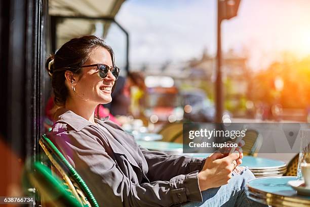 staying connected throughout the day - sassy paris stock pictures, royalty-free photos & images