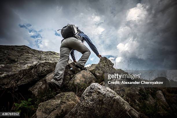 climbing on the top - aiming higher stock pictures, royalty-free photos & images