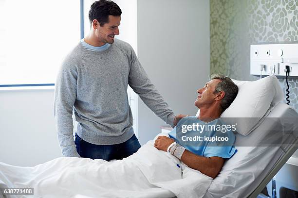 you're looking much better dad! - hospital visit stock pictures, royalty-free photos & images