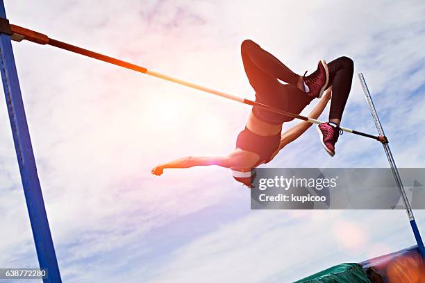going for gold - high jump stock pictures, royalty-free photos & images