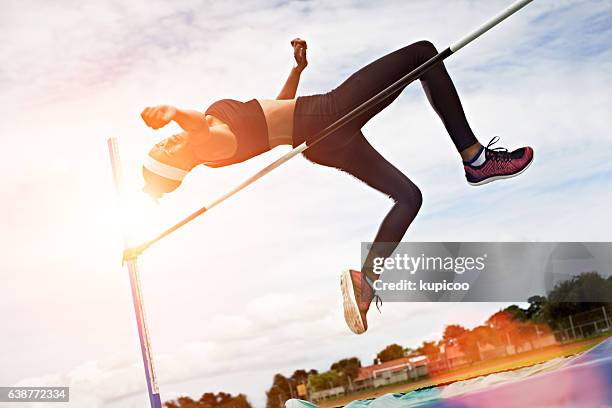 bending over the bar - high jump stock pictures, royalty-free photos & images