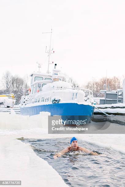 winter swimming - winter swimming stock pictures, royalty-free photos & images