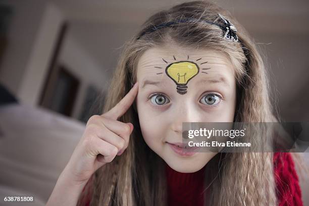 child with light bulb idea - girl pointing bildbanksfoton och bilder