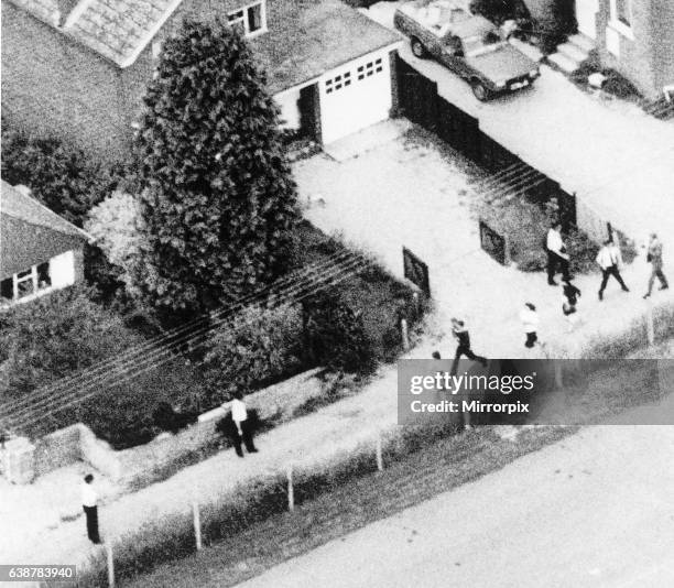 The inhabitants of Hungerford fleeing in distress past the house of the mother of gunman Michael Ryan who fled from there into the town centre to...