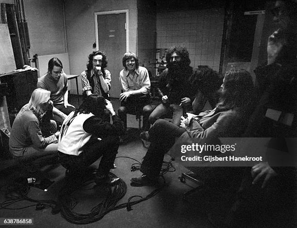 Group portrait of The Grateful Dead, backstage in the dressing room at the Tivoli Concert Hall in April 1972 in Copenhagen, Denmark.