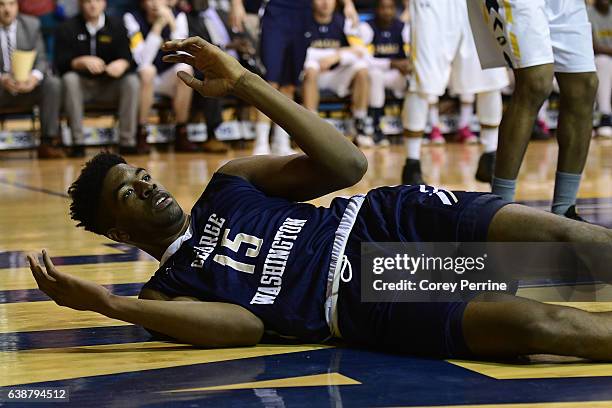 Collin Smith of the George Washington Colonials hits the floor against the La Salle Explorers during the first half at Tom Gola Arena on January 15,...