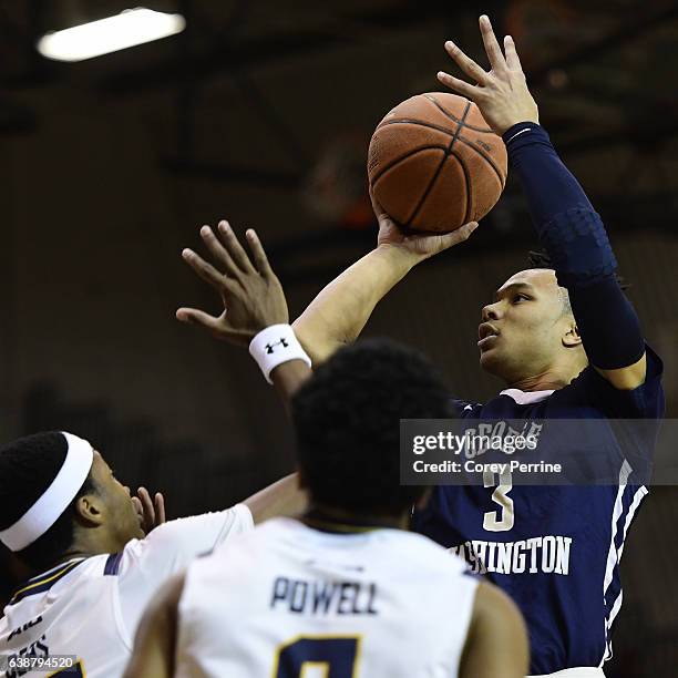 Jair Bolden of the George Washington Colonials shoots over Isiah Deas of the La Salle Explorers during the first half at Tom Gola Arena on January...