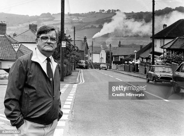 An everyday scene in Risca, Mr John Herbert pictured in Gelli Avenue with the smoke billowing from the Brickhouse Dudley factory chimney. Valley...