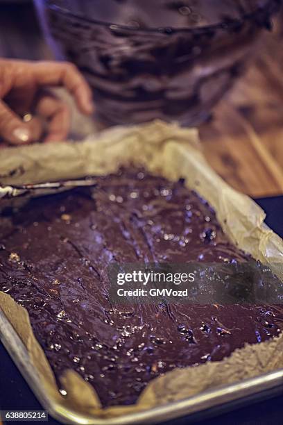 preparing chocolate cake batter for brownies - wife beater stock pictures, royalty-free photos & images