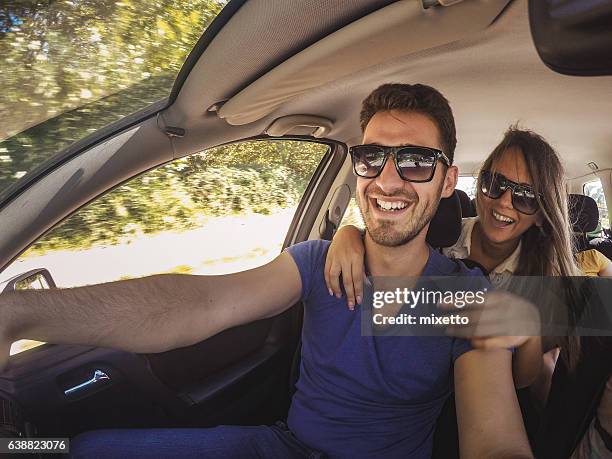 selfie in the car - embracing car stock pictures, royalty-free photos & images