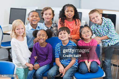 Multiracial Elementary School Children In Computer Class High-Res Stock