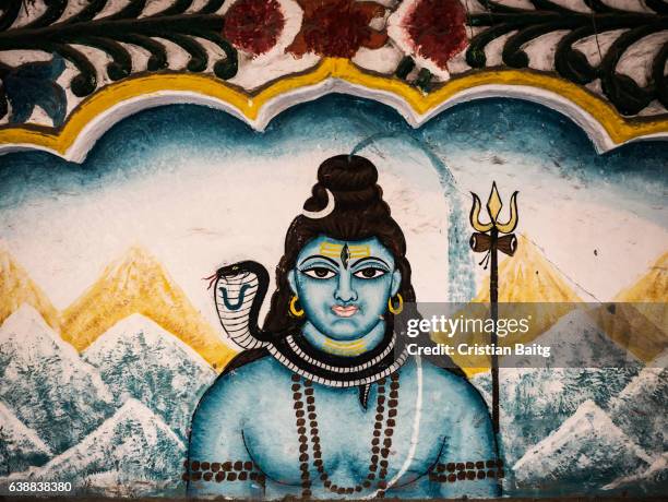 lord vishnu painting in the street in jodhpur india - shiva stock-fotos und bilder