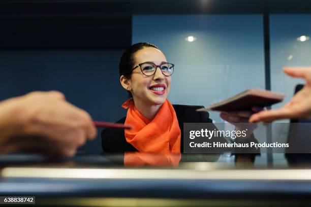 backpackers checking-in at airline counter - idrottsplatspersonal bildbanksfoton och bilder