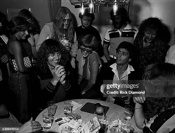 Bev Bevan of ELO and guests are entertained by Magician Bob Dubek during ELO press reception at the Peachtree Plaza in Atlanta Georgia, July 06, 1978