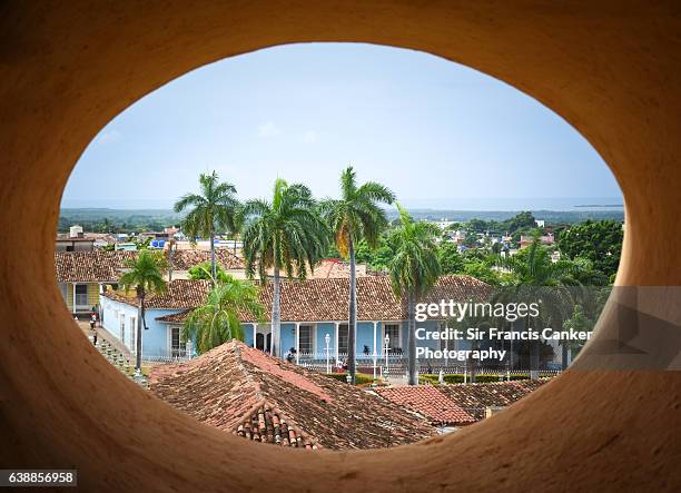 trinidad cityscape with plaza mayor seen from an oval window, cuba - playa ancon stock pictures, royalty-free photos & images