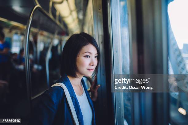 female tourist on subway - businesswoman nyc stockfoto's en -beelden