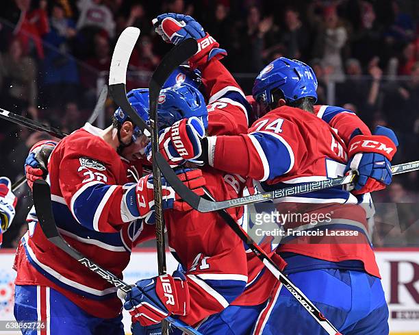 Paul Byron, Brian Flynn, Alexei Emelin, Phillip Danault and Shea Weber of the Montreal Canadiens celebrate a goal against the New York Rangers in the...