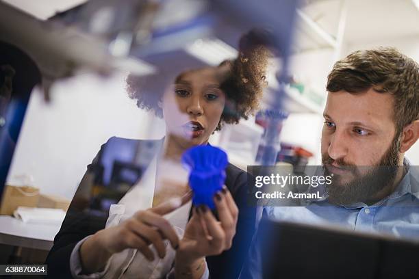 amazed by 3d printing - science collaboration stock pictures, royalty-free photos & images