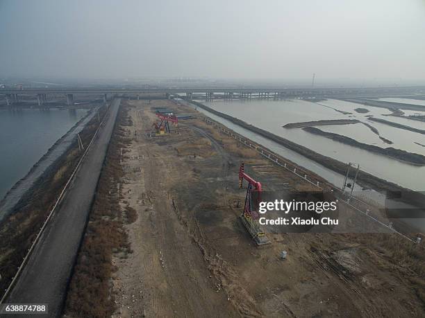 Aerial view of oil pumping units in smog on January 6, 2017 in Tianjin, China. Heavy smog attacks northern and eastern recently.