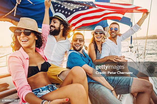 patriotism and yachting - american flag ocean stock pictures, royalty-free photos & images