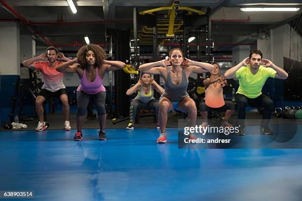 people at the gym in an aerobics class - exercise class stock pictures, royalty-free photos & images