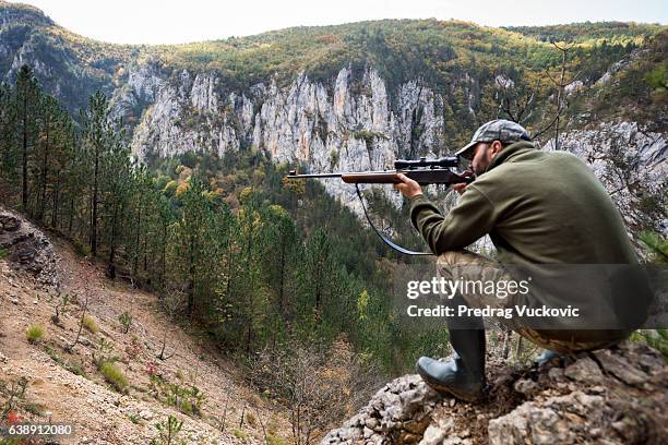 hunter in the mountains - woodland camo stock pictures, royalty-free photos & images