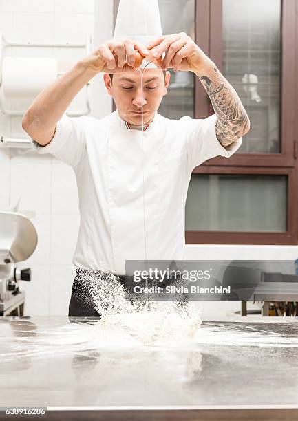 pastry chef kneads flour and egg - chef patissier stock pictures, royalty-free photos & images