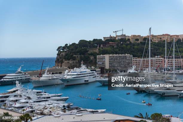view of monaco harbor with cloudy mountain - montecarlo foto e immagini stock