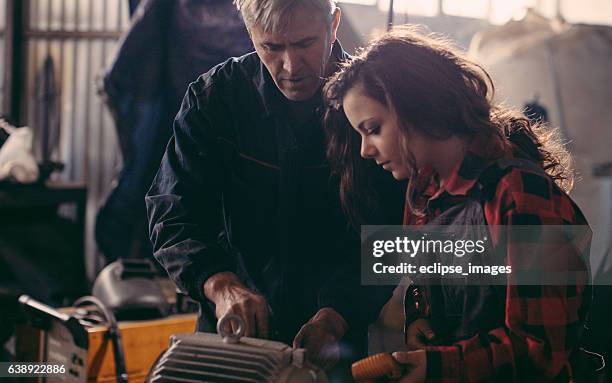 machinist examining electric motor with voltmeter - voltmeter stock pictures, royalty-free photos & images