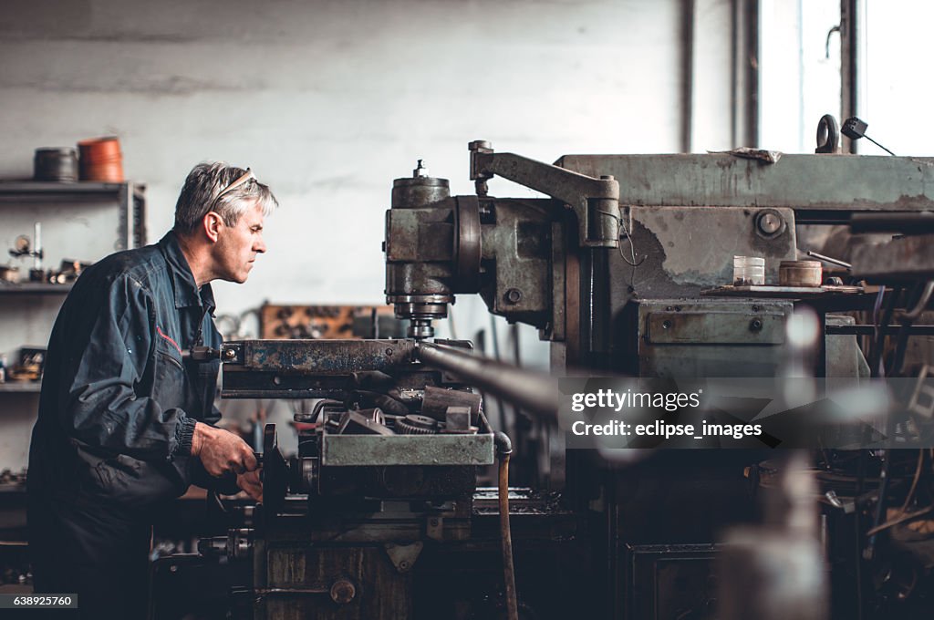 Senior man in workshop