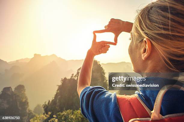 young woman framing nature - quartz sandstone stock pictures, royalty-free photos & images
