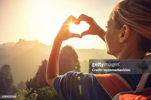 young woman loving nature - hands share stockfoto's en -beelden