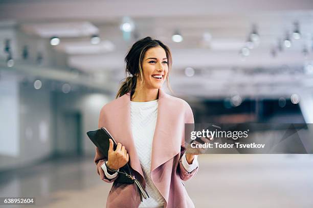 happy beautiful woman texting - grace young stock pictures, royalty-free photos & images