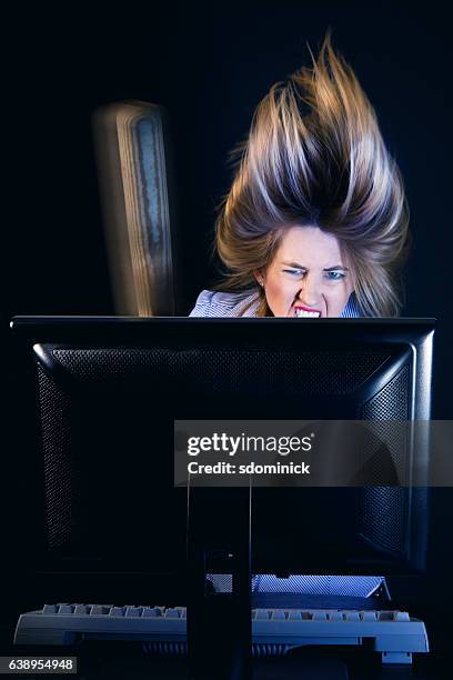 woman hitting computer with baseball bat - baseball bat stock pictures, royalty-free photos & images