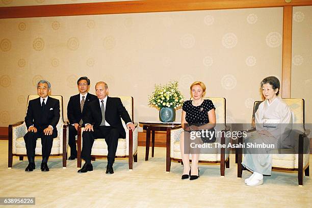 Russian President Vladimir Putin , Emperor Akihito , Empress Michiko and Putin's wife Lyudmila pose for photographs prior to their meeting at the...