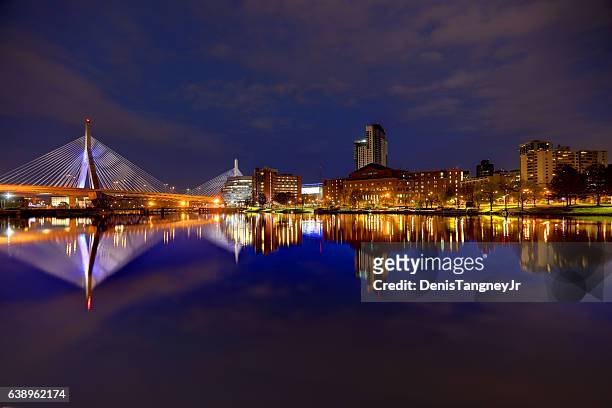 zakim bridge reflection on the charles river in boston - boston massachusetts stock pictures, royalty-free photos & images