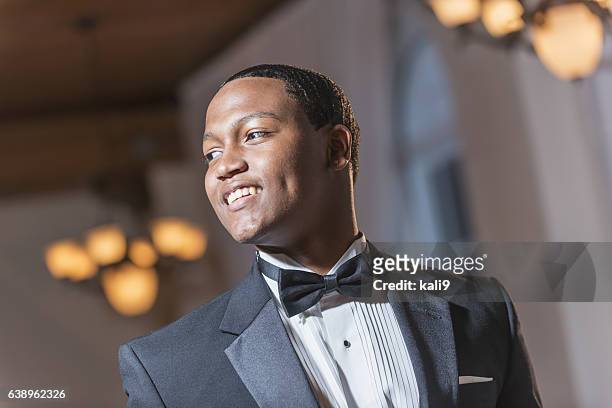 young black hispanic man wearing tuxedo - tuxedo party stock pictures, royalty-free photos & images