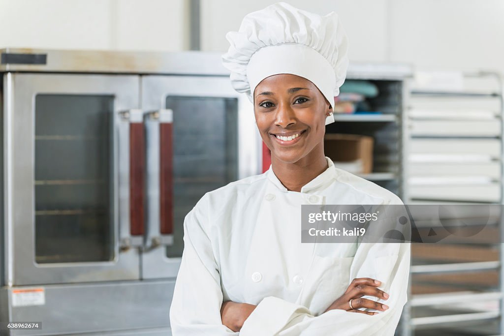 African American female chef in commercial kitchen