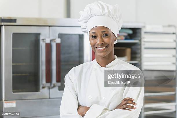 african american female chef in commercial kitchen - black chef stock pictures, royalty-free photos & images